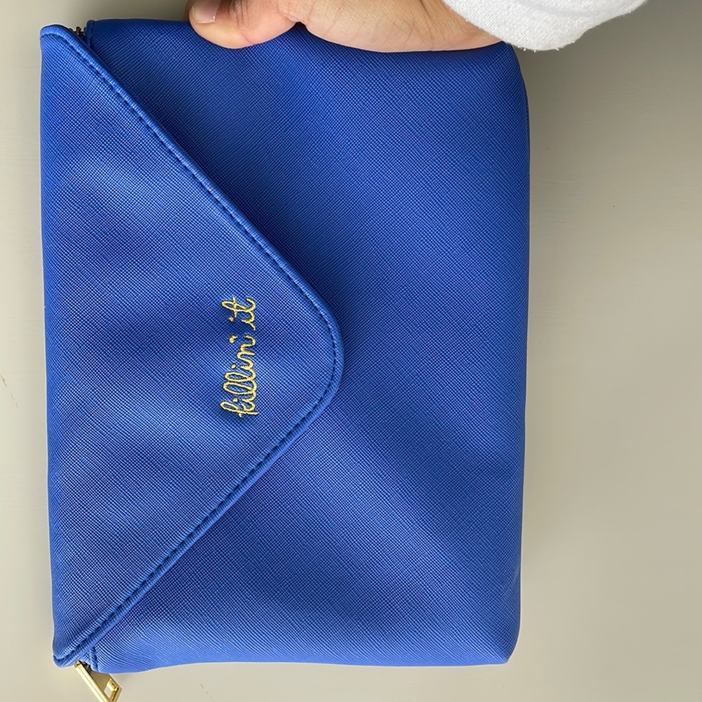A Blue cosmetic or carry small purse/pouch